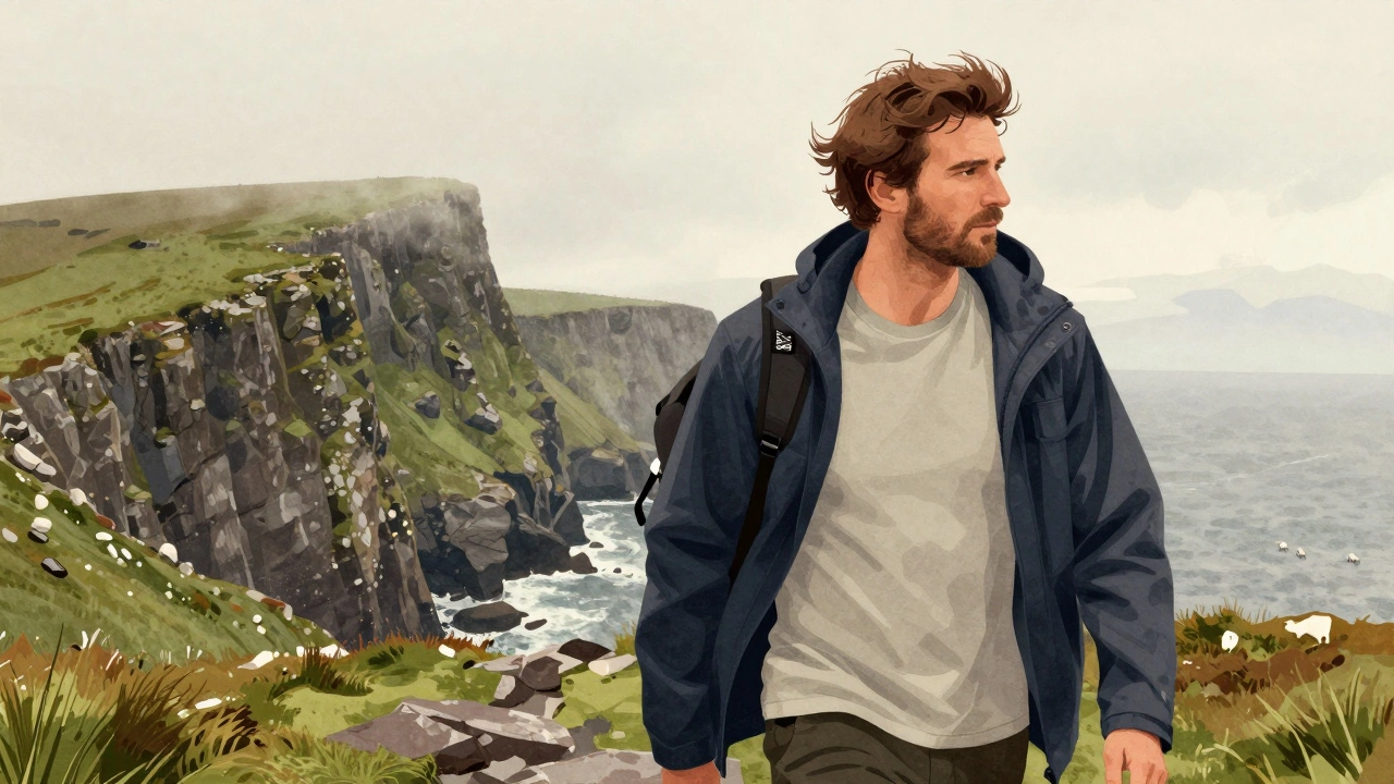 Hiker on Wild Atlantic Way wearing breathable t-shirt under waterproof jacket.