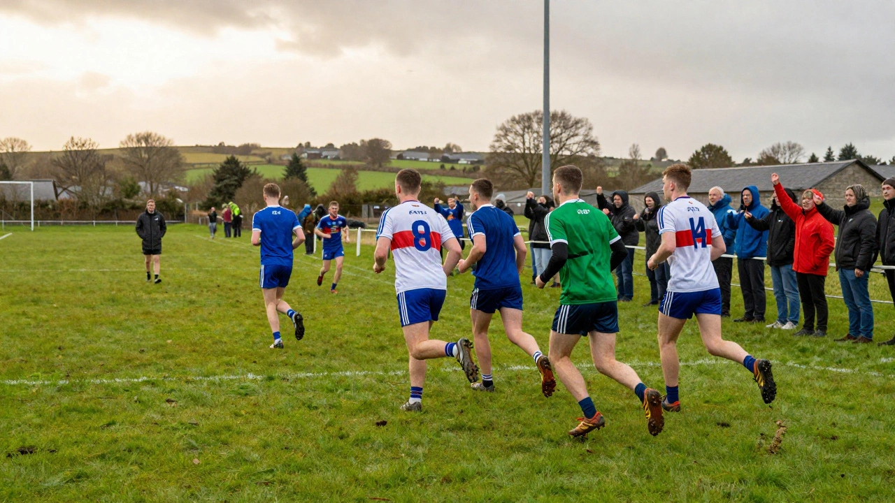 GAA players running on a wet pitch in trainers, spectators watching under cloudy skies.